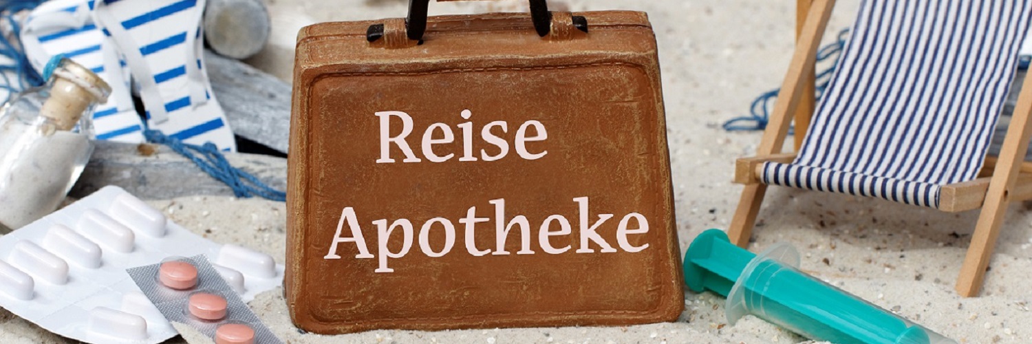 Koffer mit Schriftzug Reiseapotheke